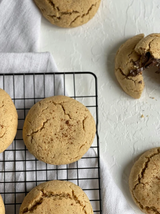 several cookies sitting on top of a cooling rack