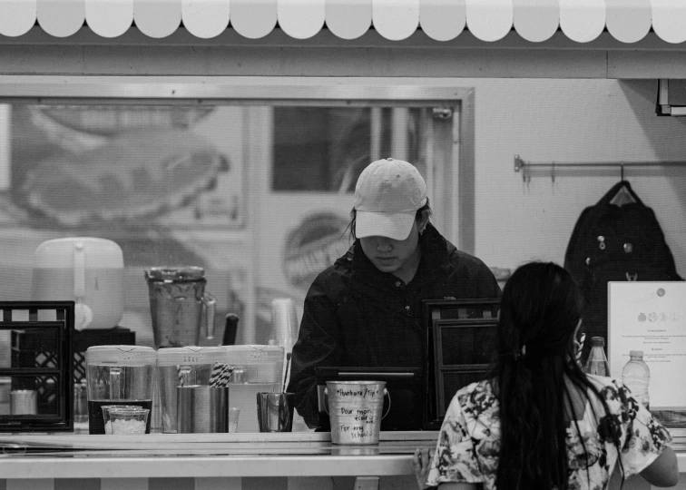 a group of people behind the counter of a store