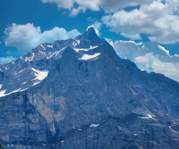 a mountain in the distance has snow on it