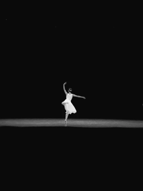 the young ballerina dances in black and white