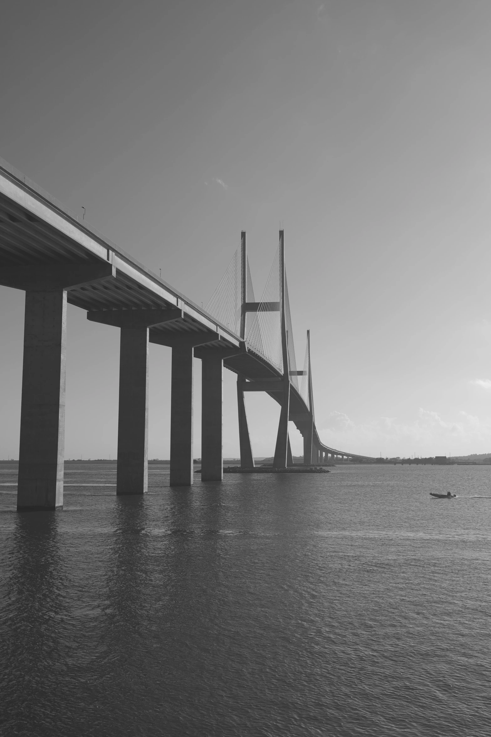 a black and white po of an ocean bridge