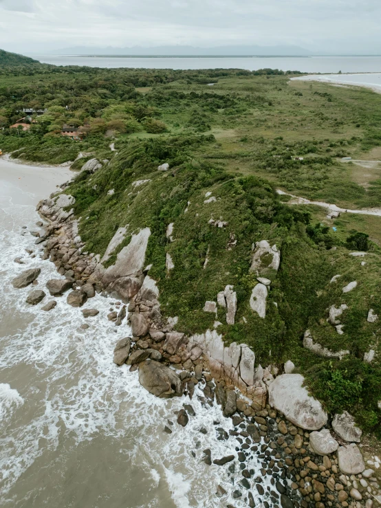 an ocean view looking down at a rocky coastline