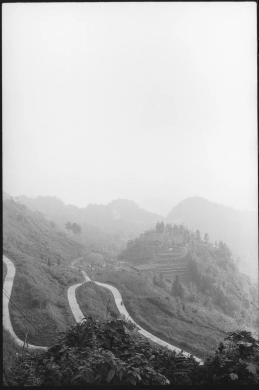 the mountain road appears to have two lane bridges at one side