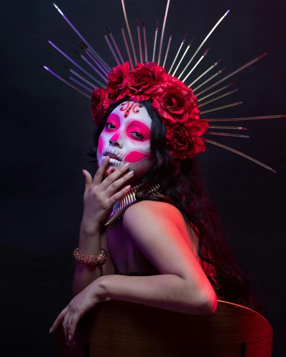 a beautiful woman wearing red makeup and white make up