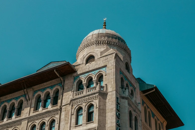 an old stone building with windows and a cupola