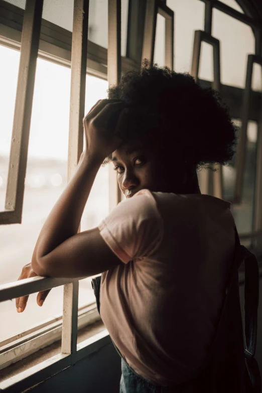 a woman looking out of a window in a bus