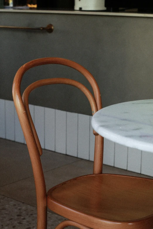 a dining table with white marble on the top