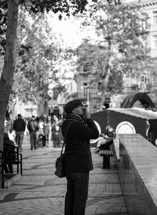 a man that is standing up by the wall