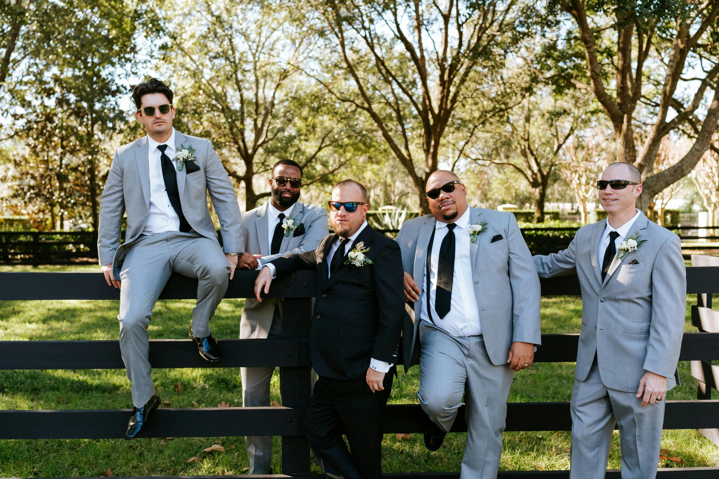 a group of men in suits posing for a po