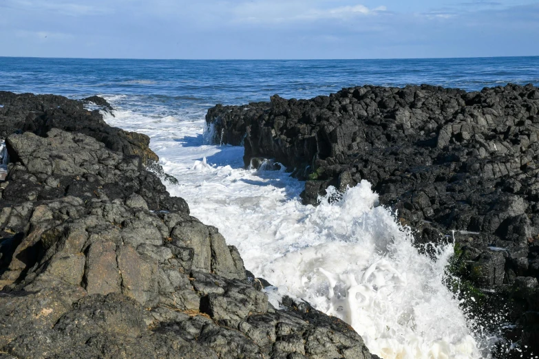 a bunch of rocks next to the ocean