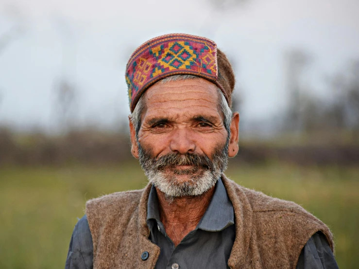 a close up of a person wearing a hat