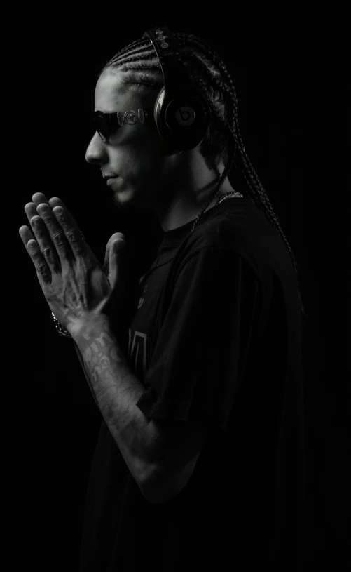 a black and white image of a person in headphones
