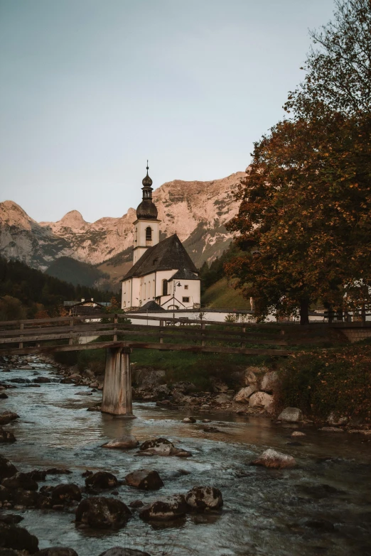 the river has many rocks and small buildings