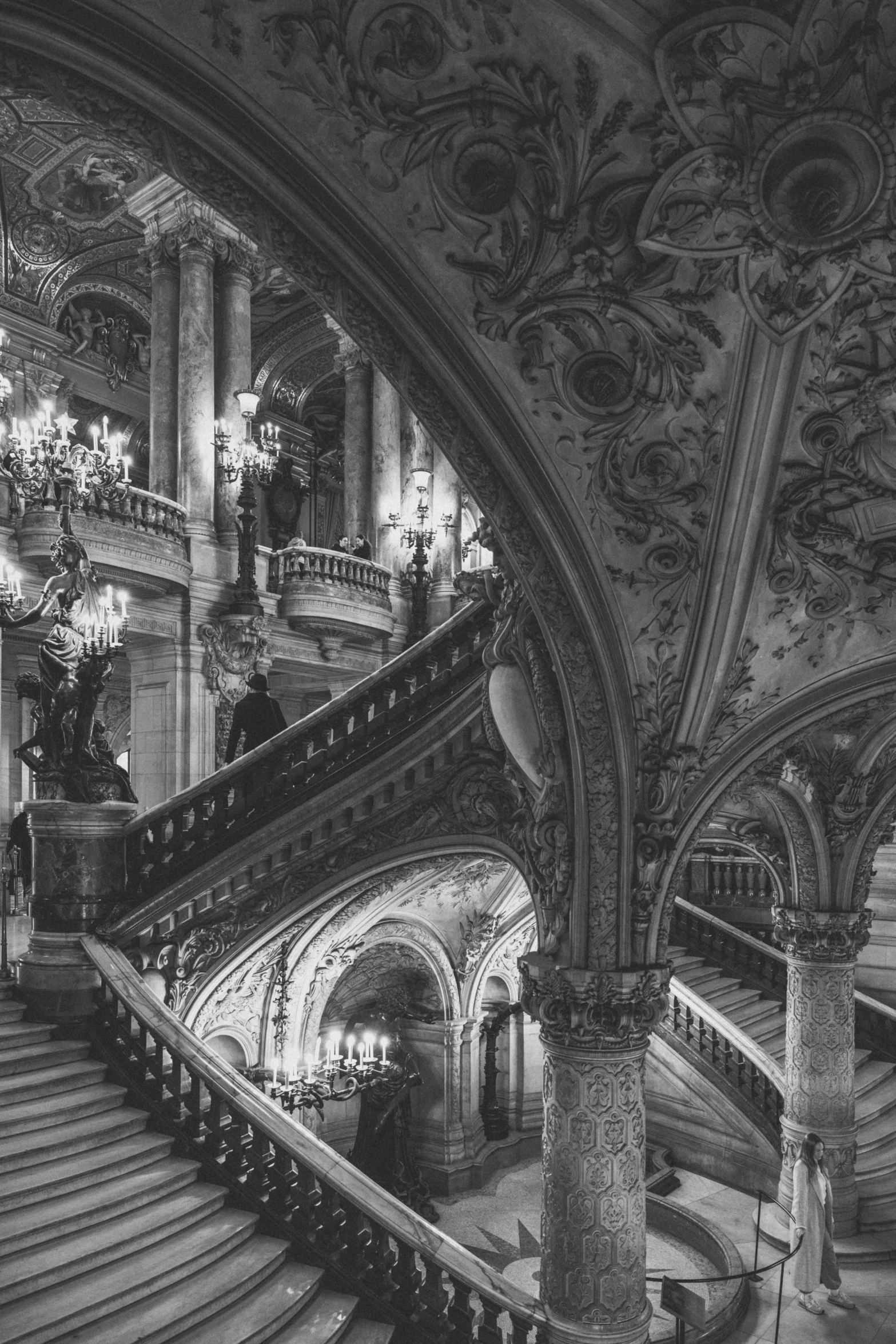 an ornate stairway in the grand el, which features many large chandeliers and chandel