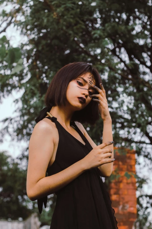 a young woman is using a cellular phone outside