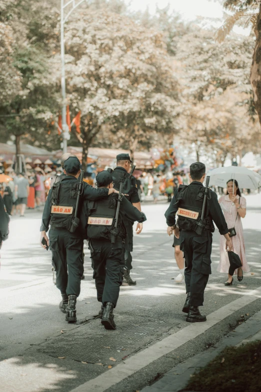 two police officers leading the way down the road