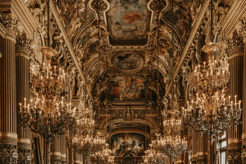 the ceiling of the building is decorated with intricate gold, black and white tiles