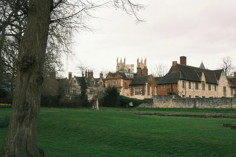 a building with a grassy field in front of it