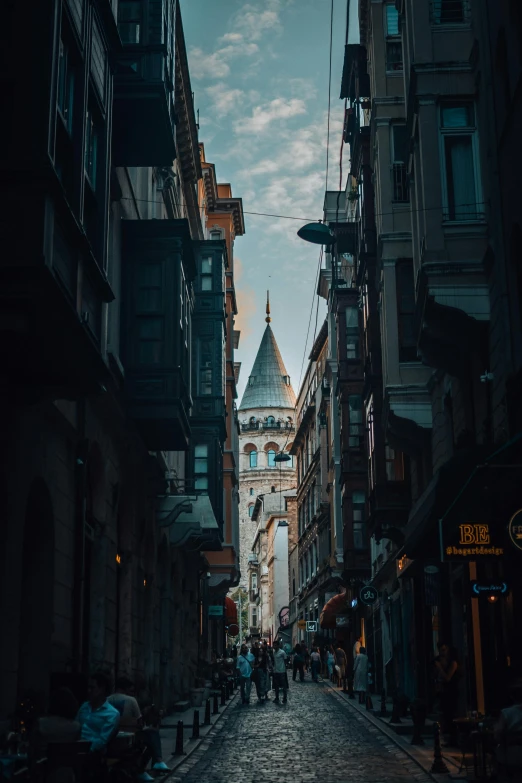 an empty street in a city surrounded by buildings