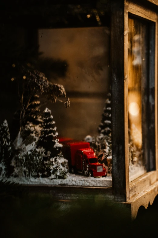 a christmas scene of a small tractor in the snow