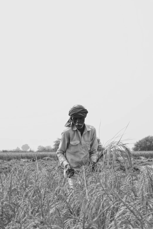 black and white pograph of man in field