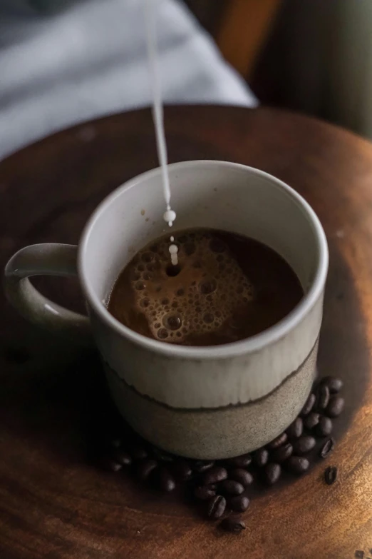 there is a cup of coffee that has a small amount