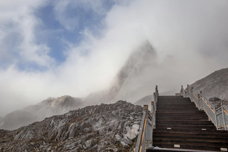 a staircase leading up to the top of a mountain