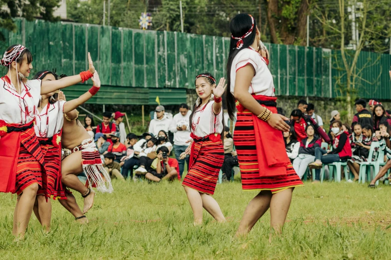 a group of dancers performing for a crowd