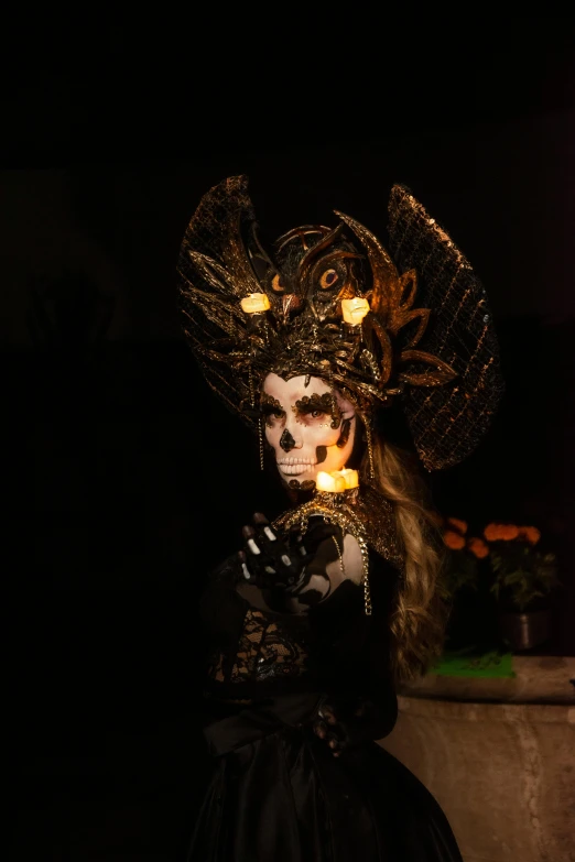 a doll dressed in black wearing a lighted outfit