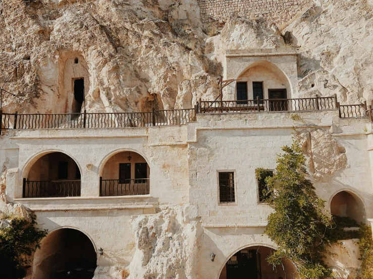 there is a house that looks like a castle built into a mountain