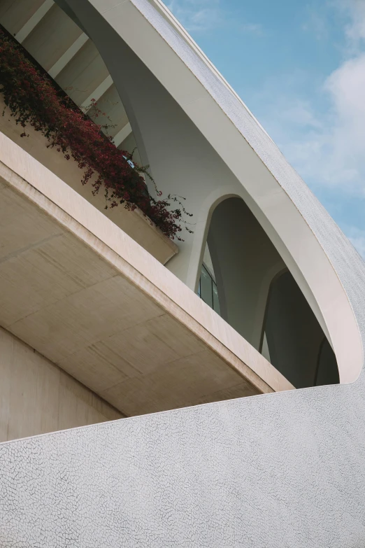 a building with an overhang and a clock on the top