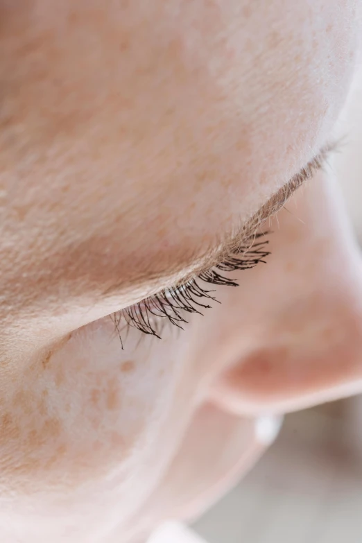 a close - up of a woman's eye with long lashes