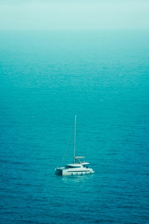 a boat floating in the middle of a body of water