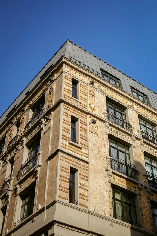 a tall building with balconies on the top of it