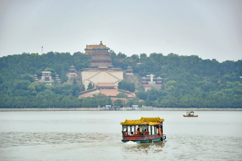 a boat that is in the middle of water with buildings on it