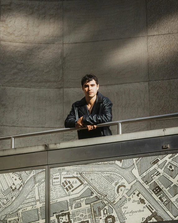 a person stands on the edge of a railing