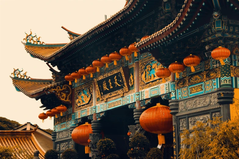 an asian styled architecture has lanterns at the top