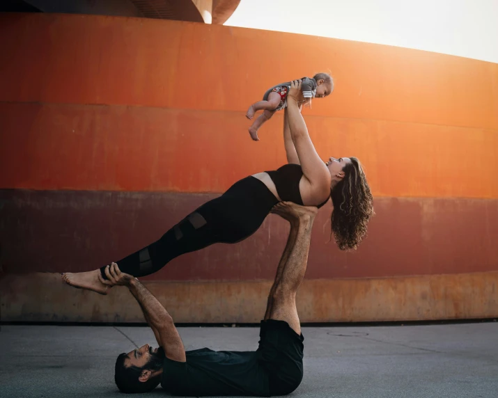a man and a woman doing yoga together