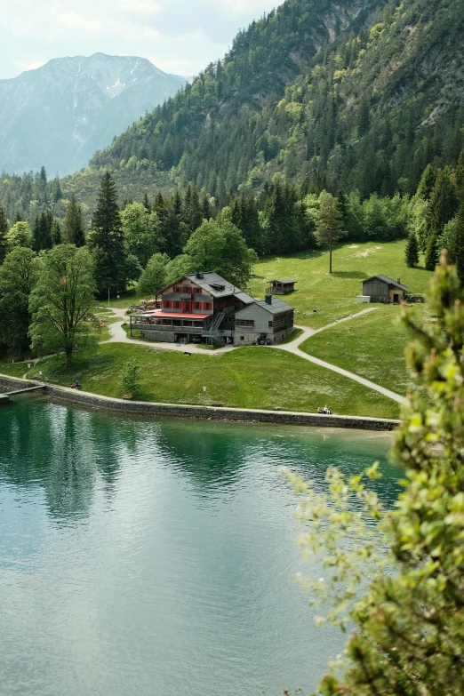 there is an elegant cabin by the water