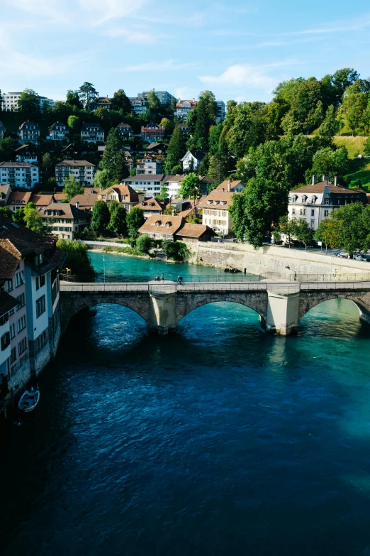 bridge spanning water with several buildings on either side