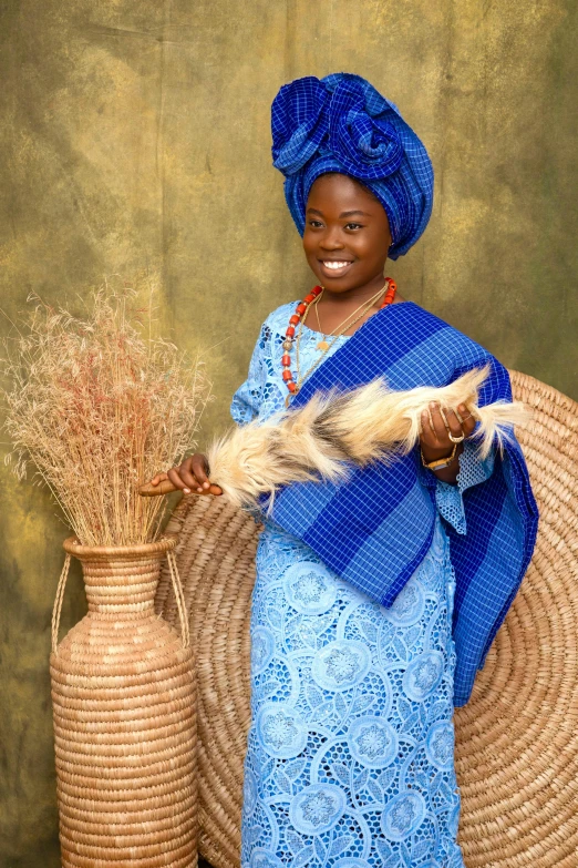 the woman is standing in front of two large vases