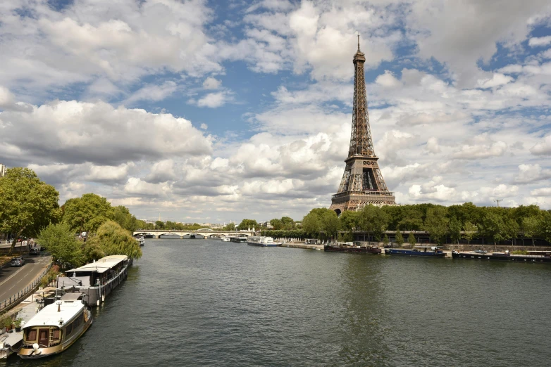 the view of the eiffel tower from across the river