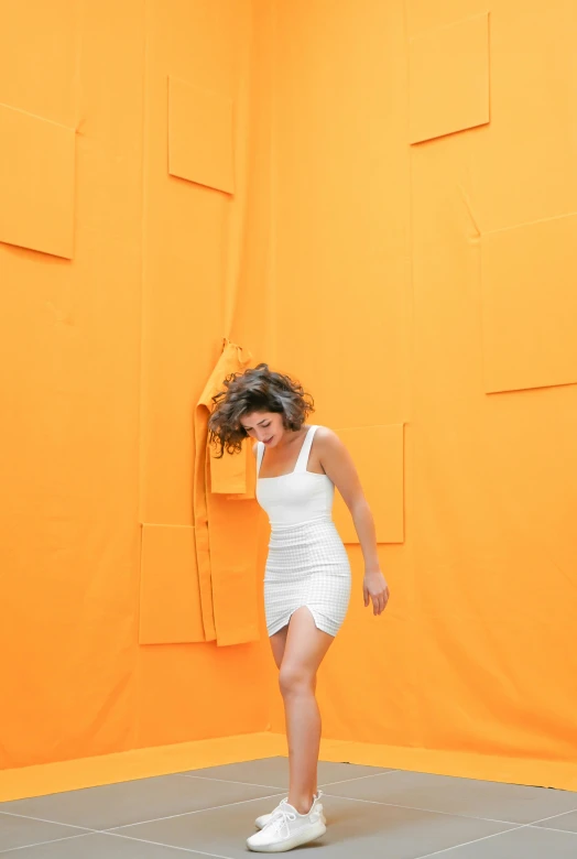 a woman standing on top of a white floor