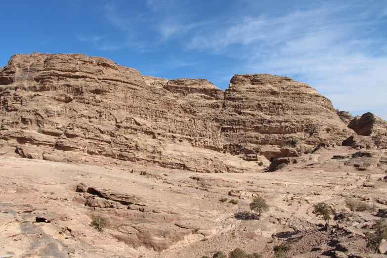 some mountains are brown and one is rock