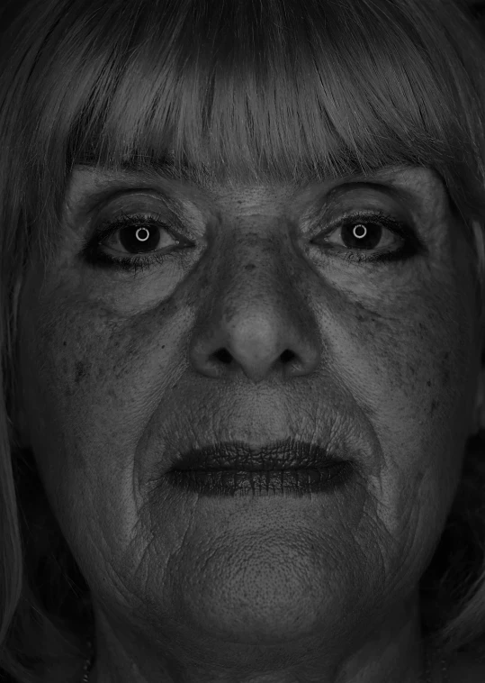 an old woman has wrinkles on her eyes