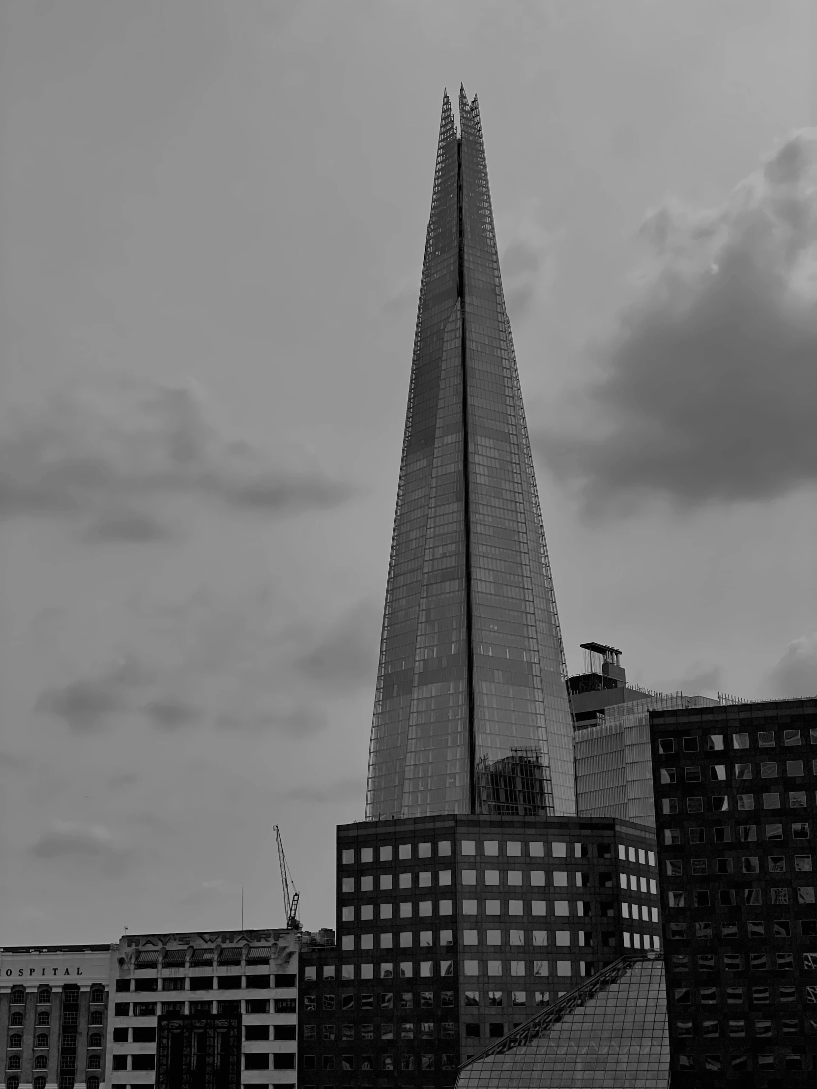 a very tall building surrounded by other buildings