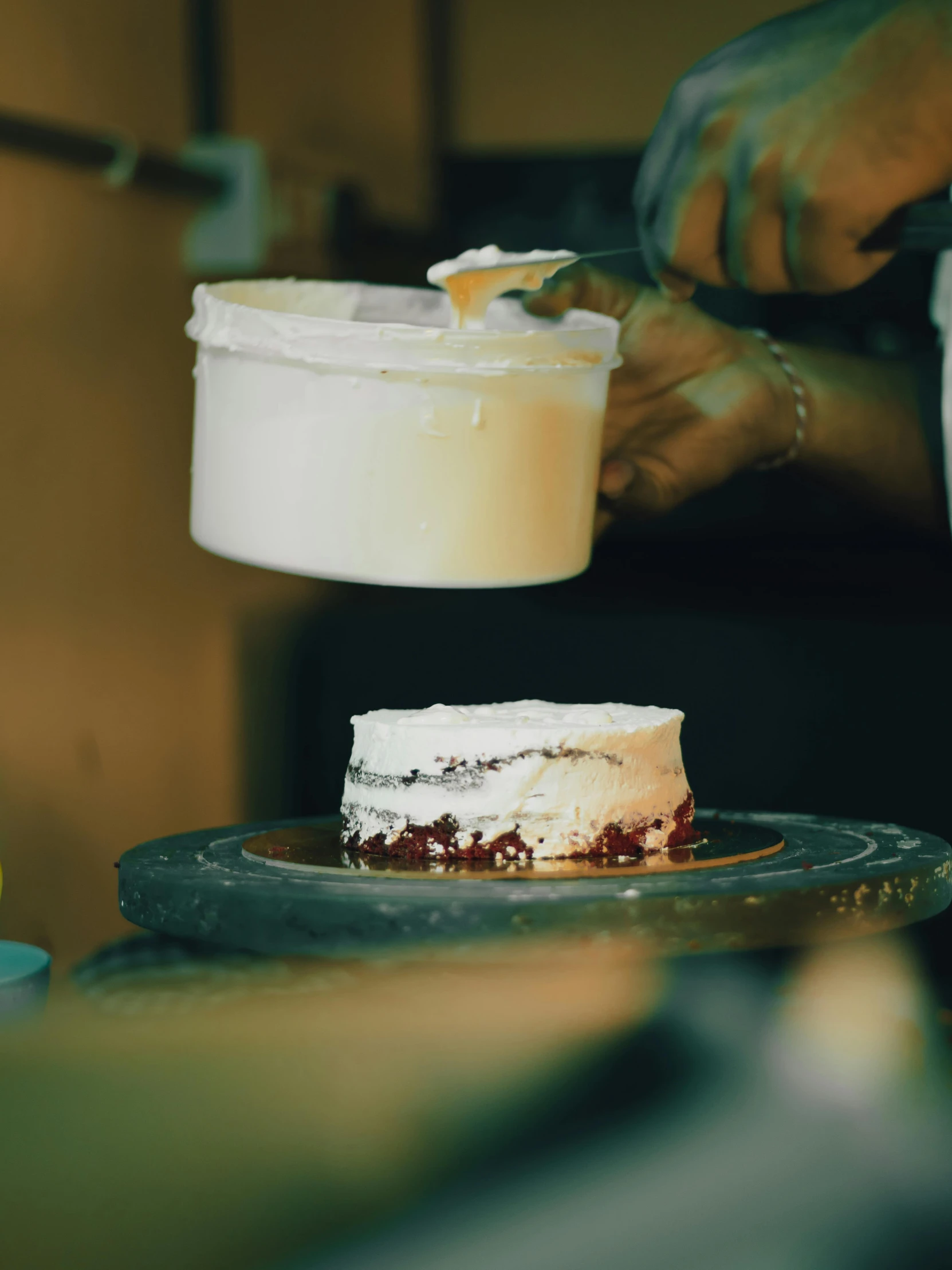 an individual slicing into a piece of cake