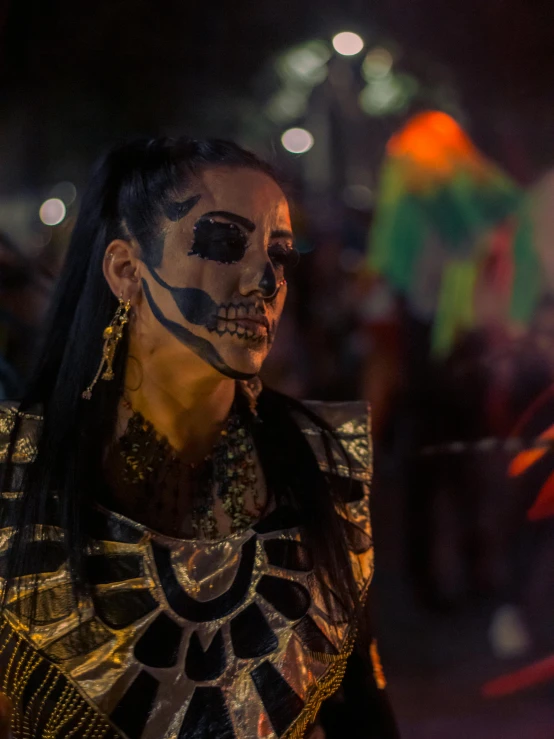 a woman with face makeup in a dark room