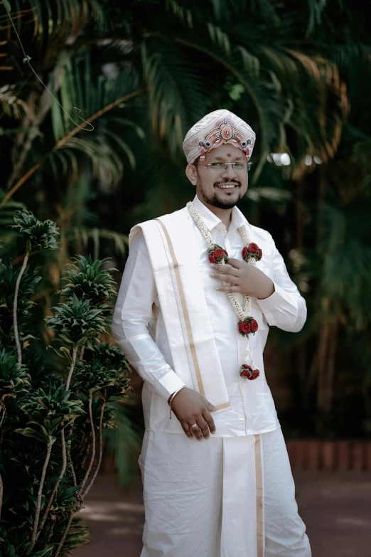 a man dressed in white and with painted face