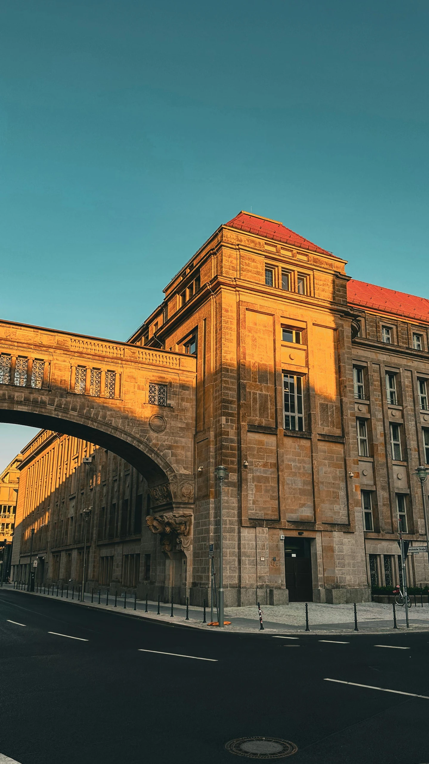 a building with some large windows and bridge over it